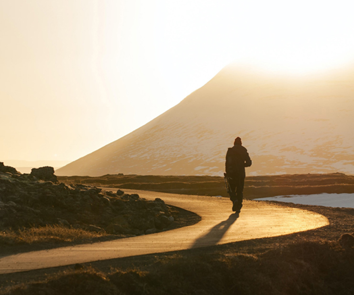 Man walking along road