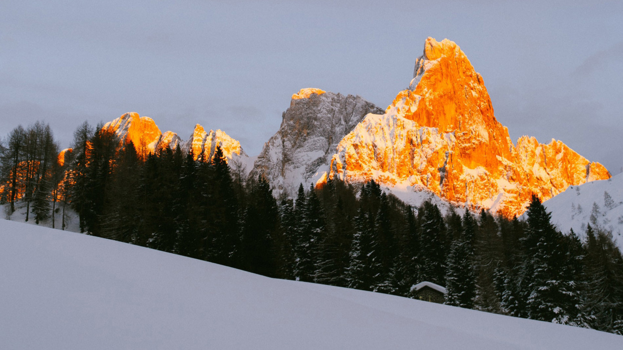Sun against a mountainside