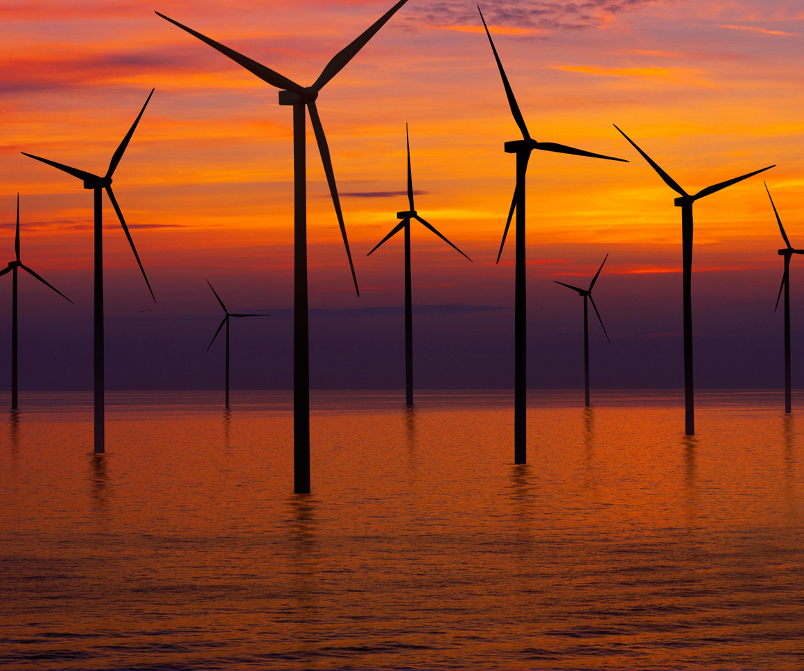 Offshore Wind Turbines At Sunset
