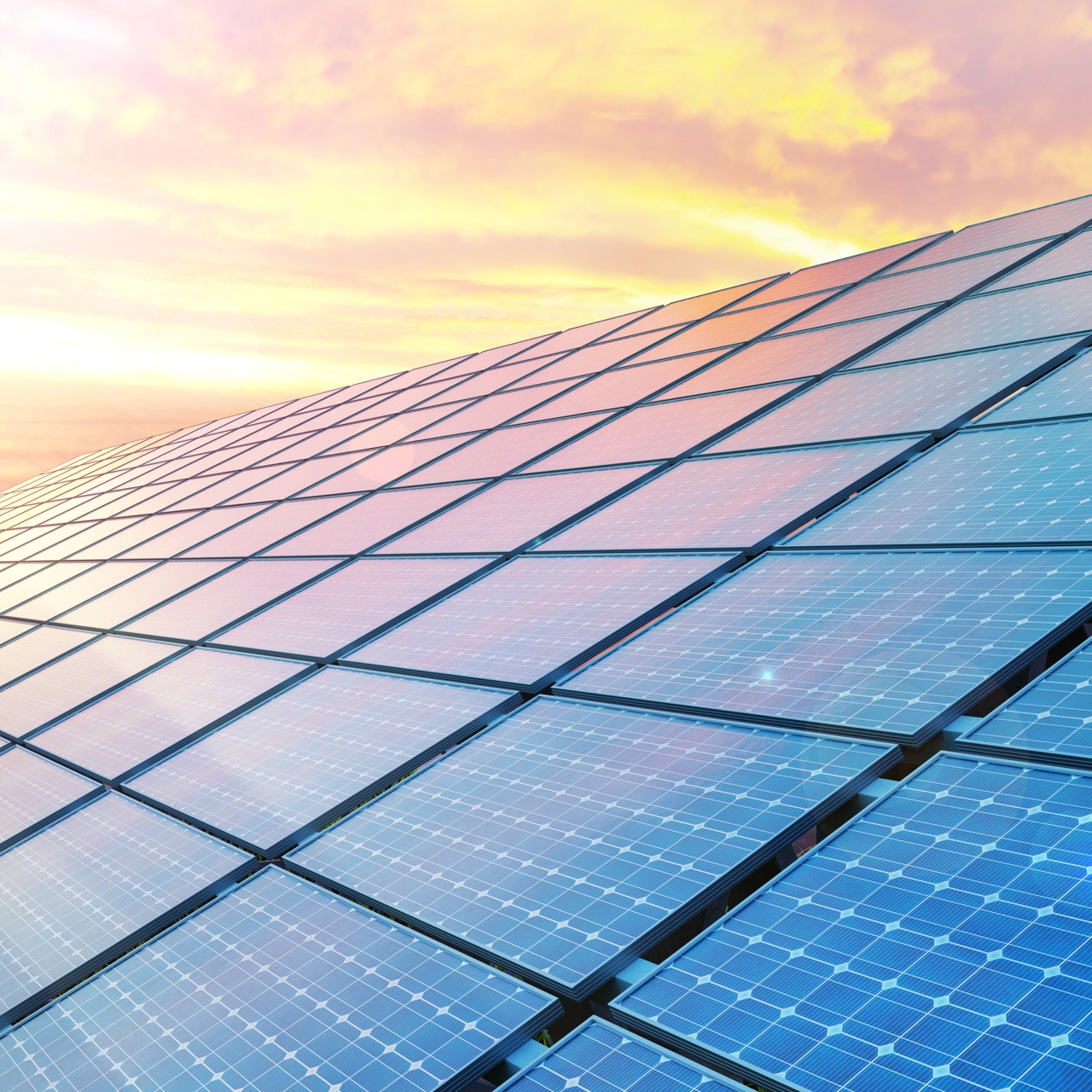 Solar Panels Against A Sunset Sky