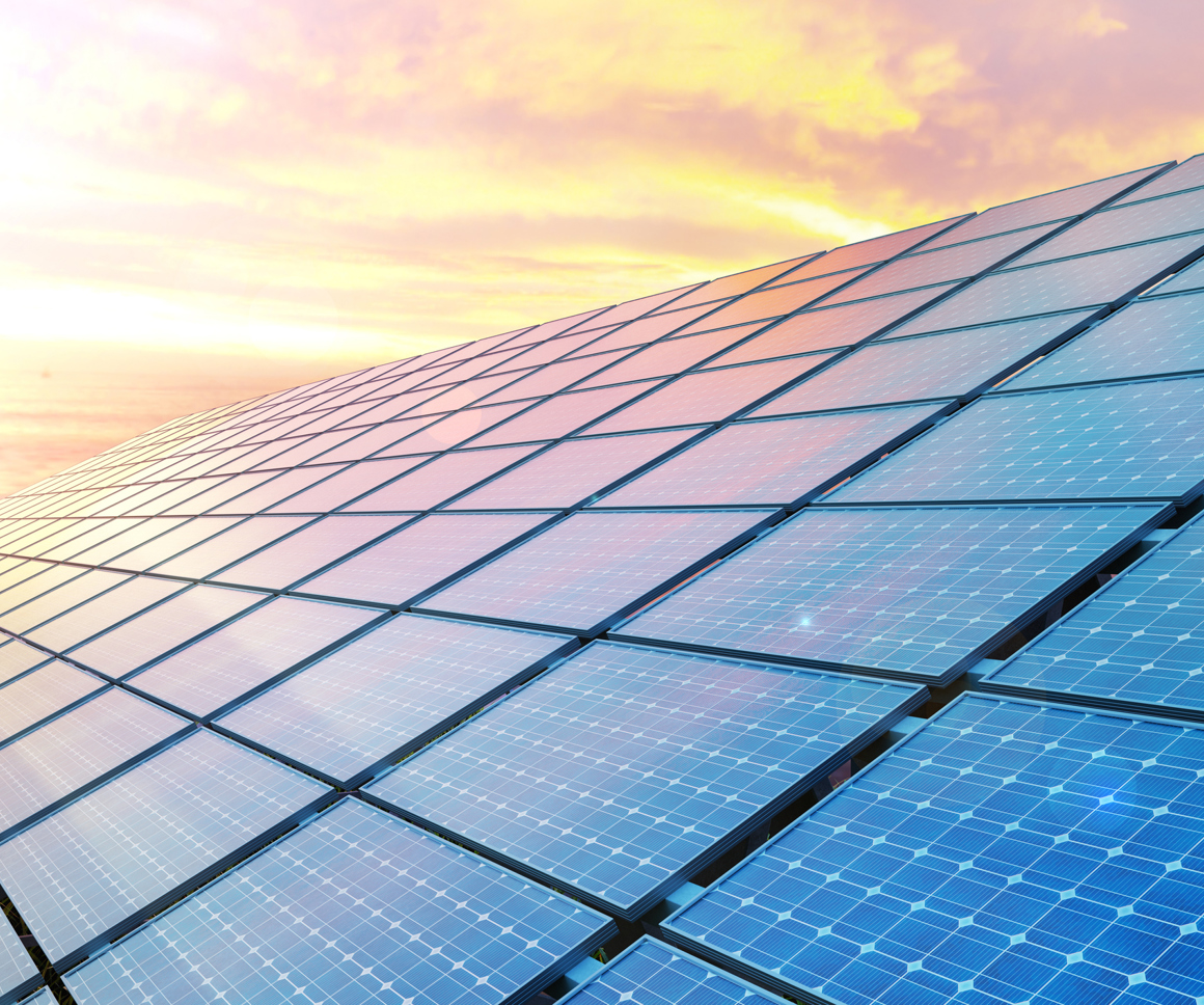 Solar Panels Against A Sunset Sky