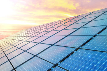 Solar Panels Against A Sunset Sky