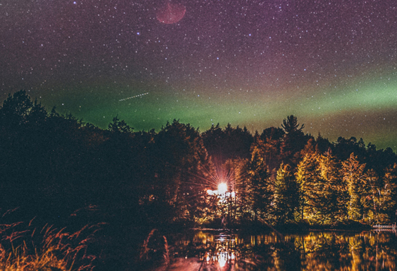Light shining over a lake at night