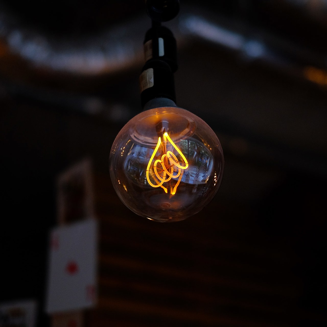 Lightbulb Against A Dark Background