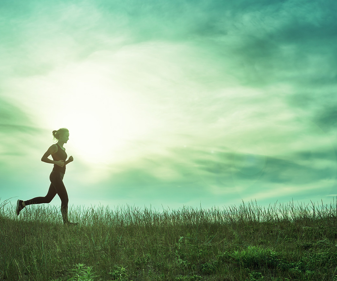 Woman running in a field
