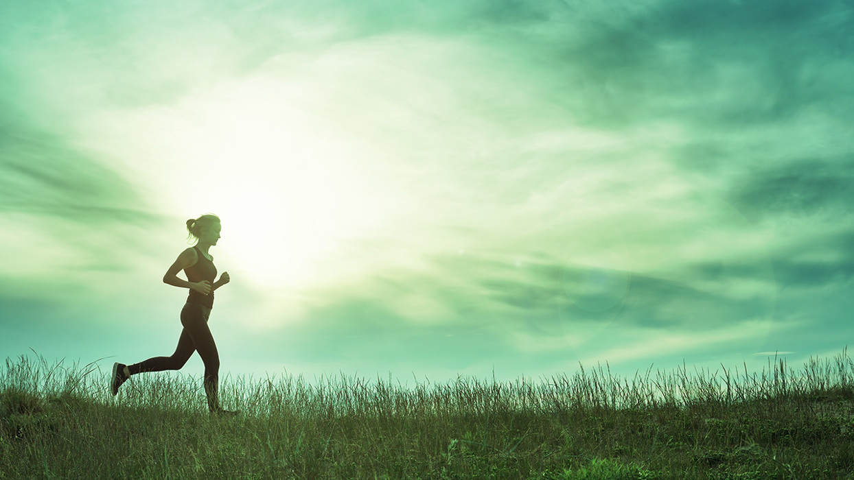 Woman running in a field
