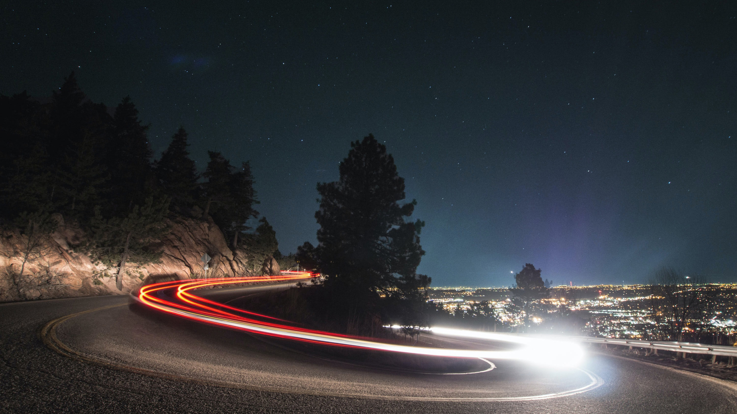 Winding road with car lights