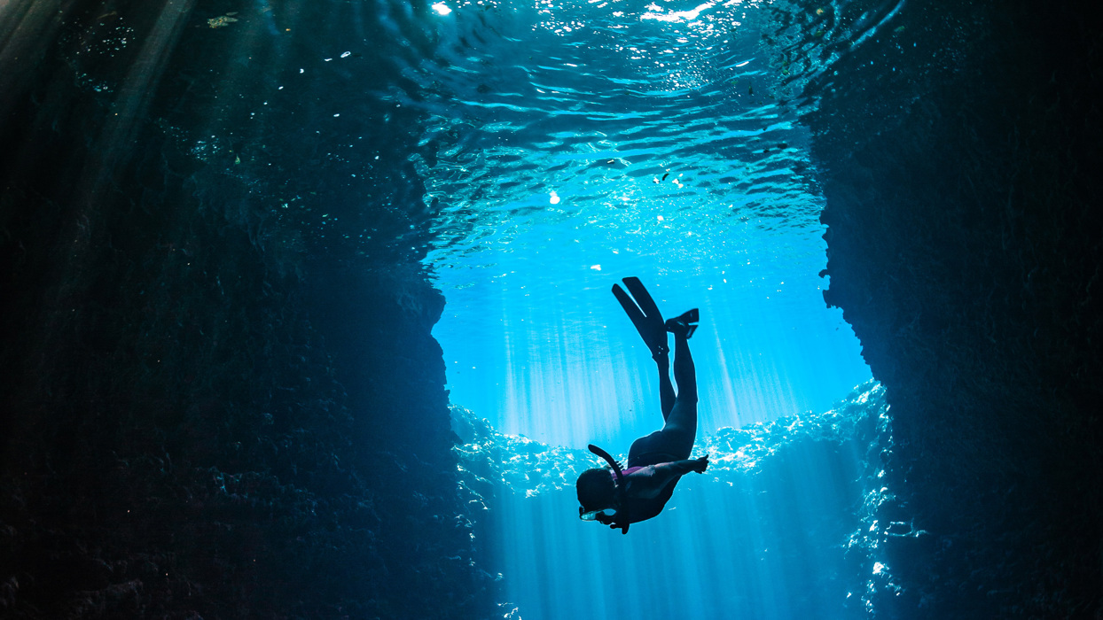 Woman diving into water