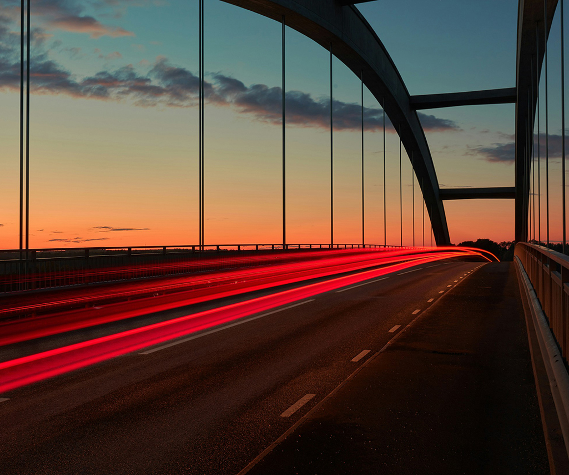 Long exposed photo of traffic crossing a bridge
