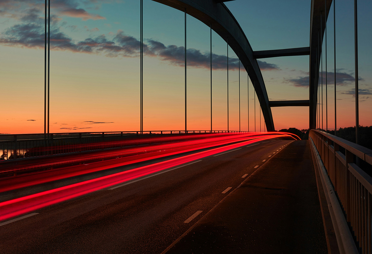 Long exposed photo of traffic crossing a bridge