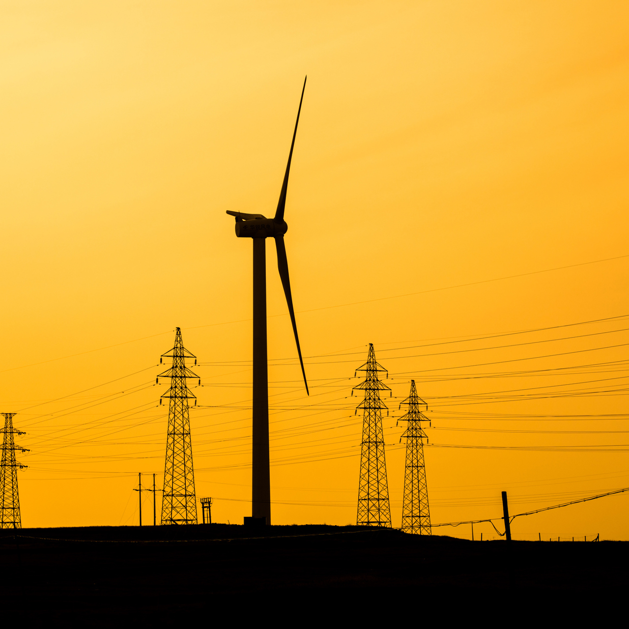 Transmission Pylons And Wind Turbines