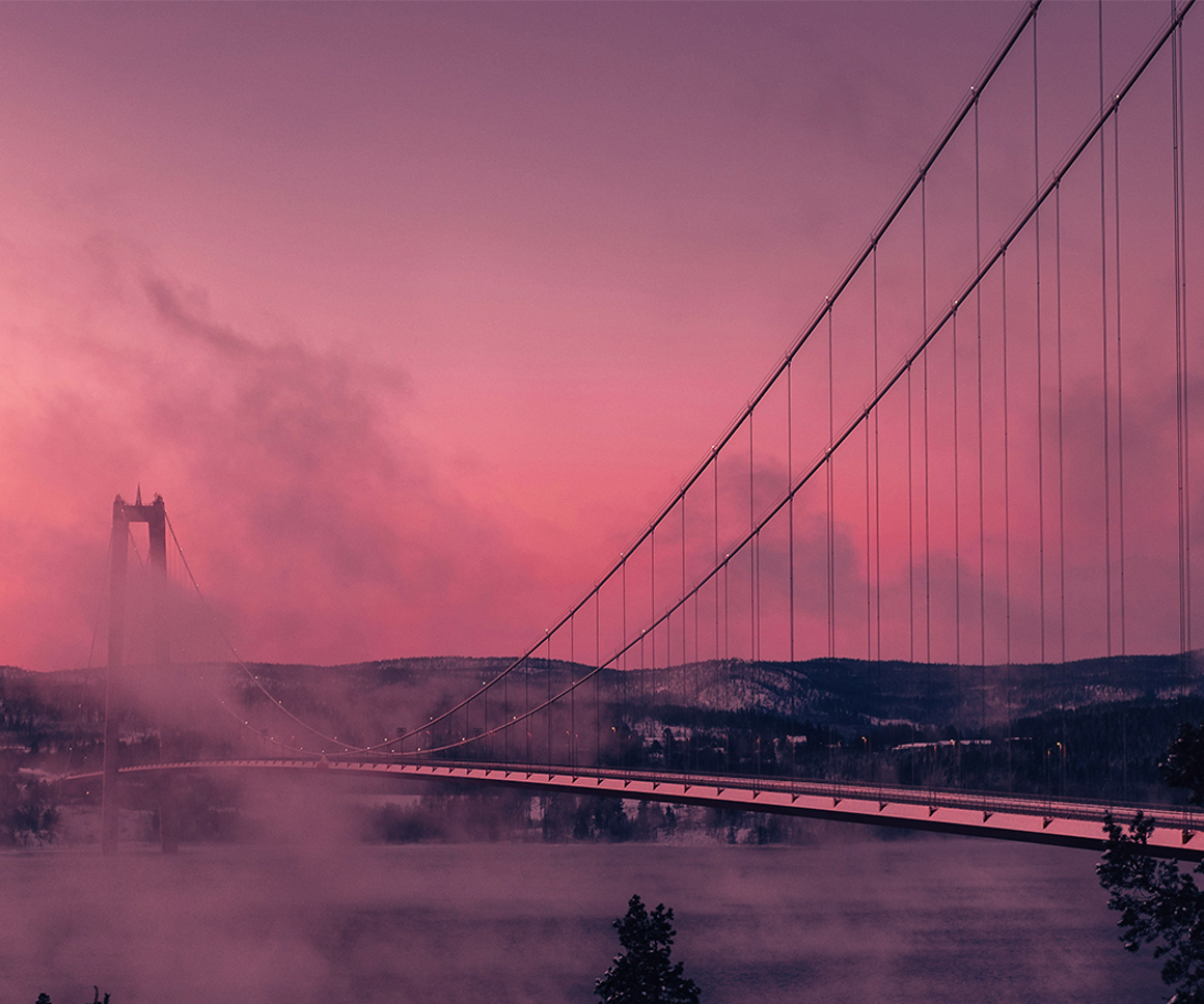 Misty bridge over a river