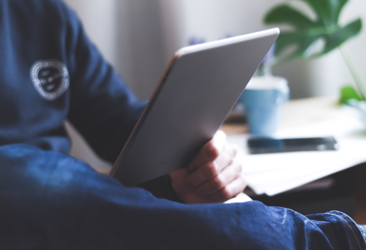 Man reading an ipad