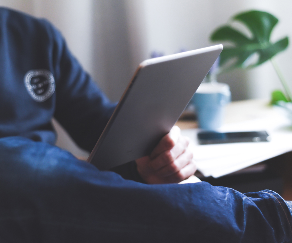 Man reading an ipad
