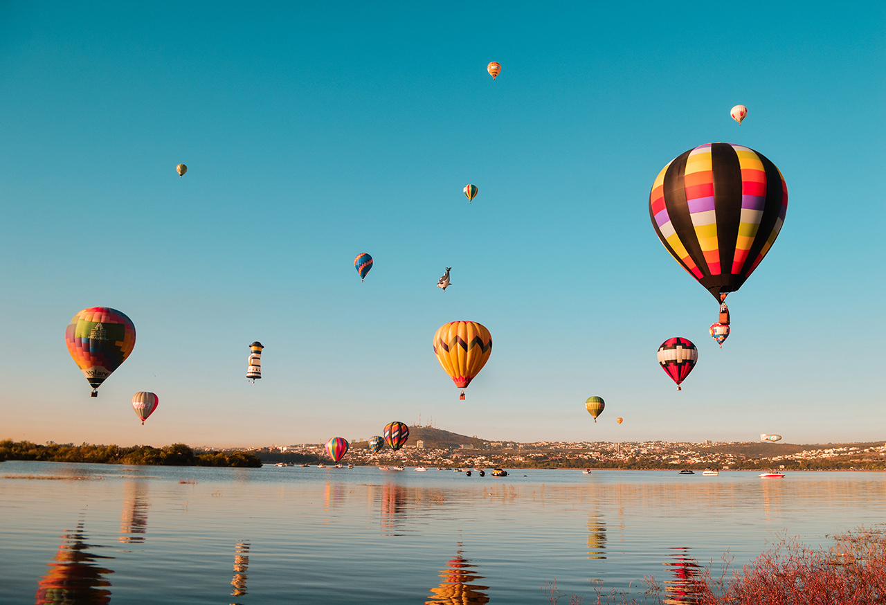 Hot air balloons over water