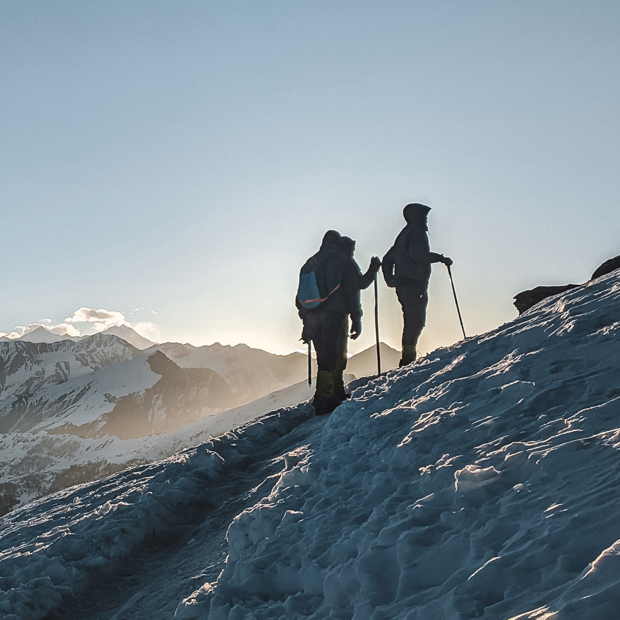 Hikers going up a snowy mountain