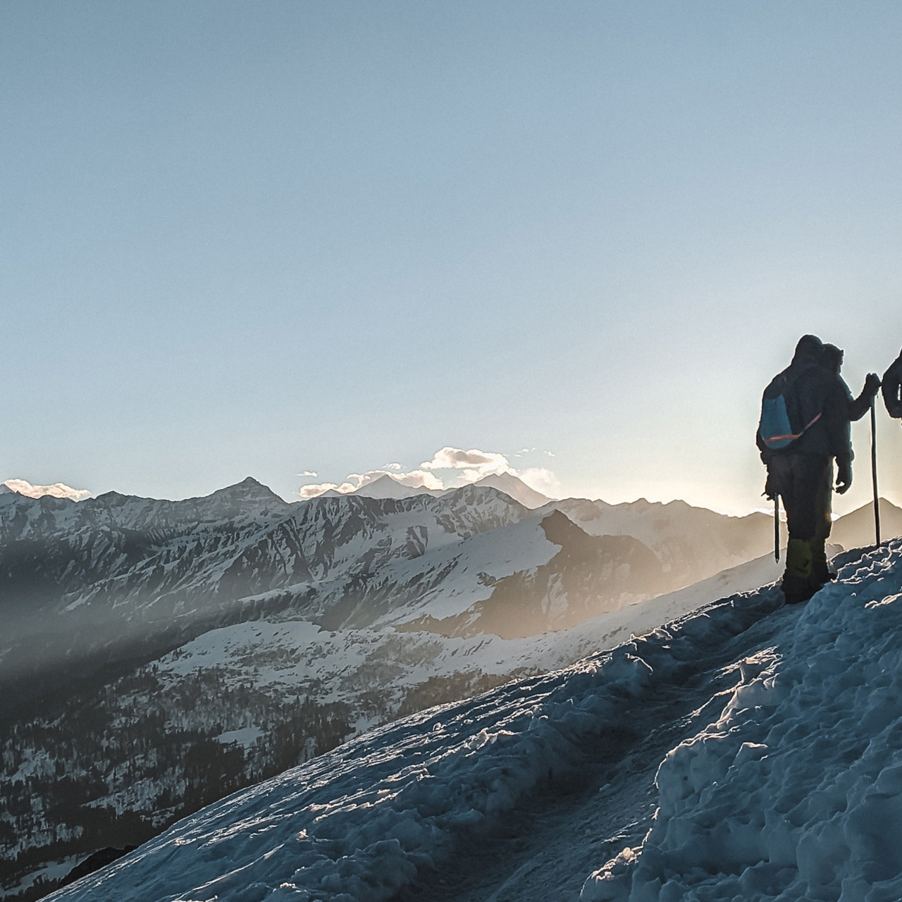 Hikers going up a snowy mountain