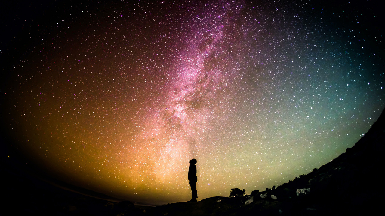 Man looking at starry sky