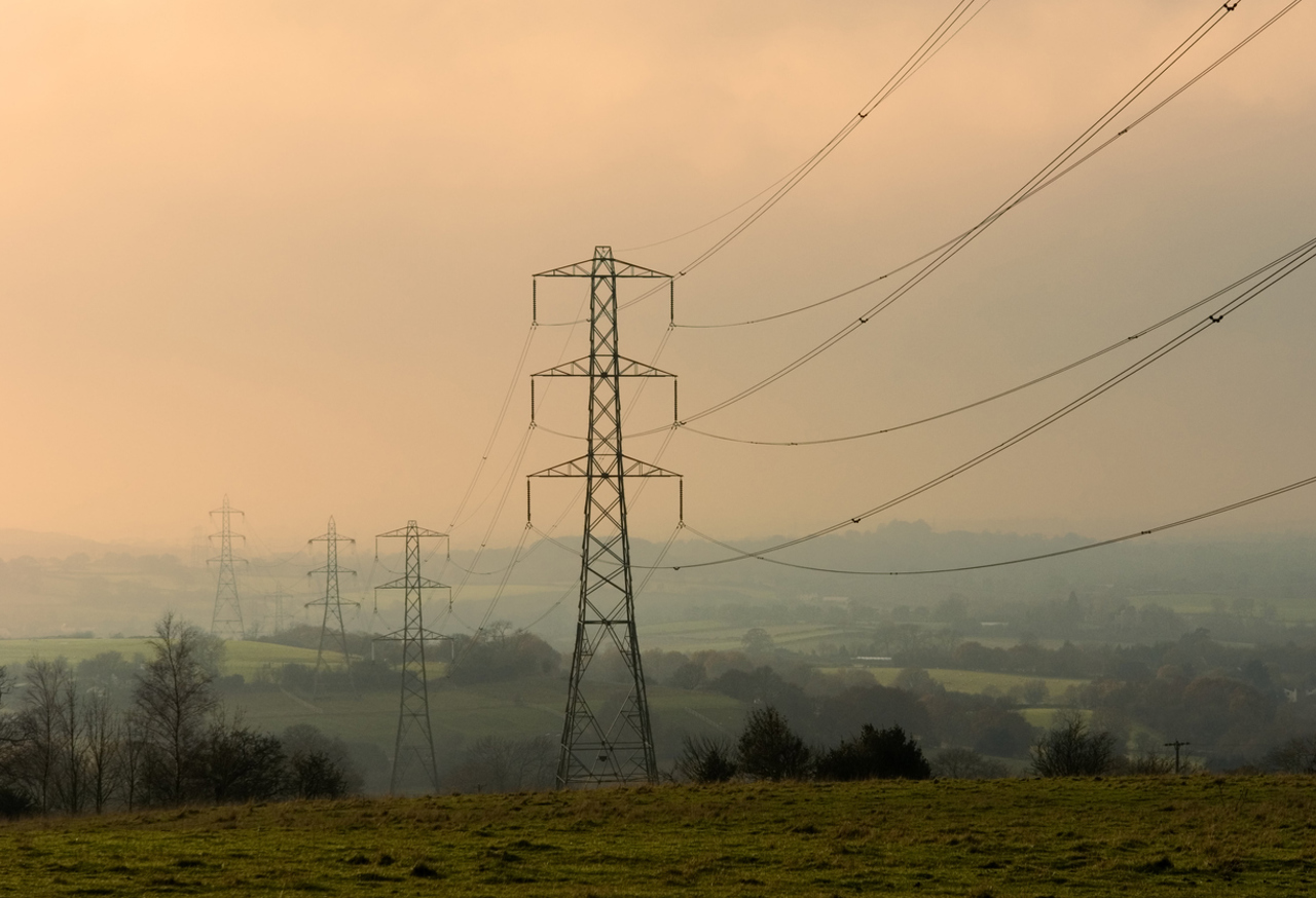 Transmission Wires On A Misty Morning In The Countryside