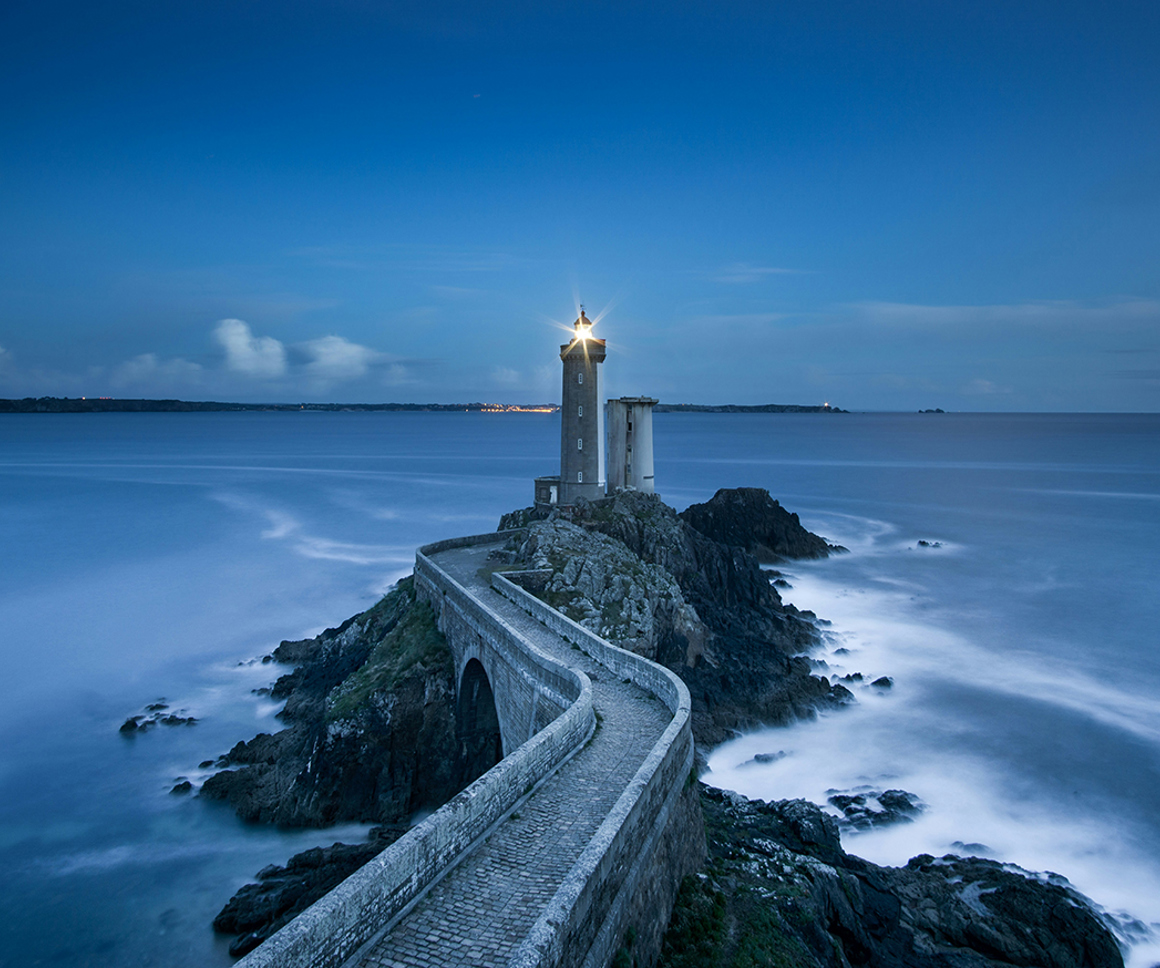 Lighthouse on a rocky outreach