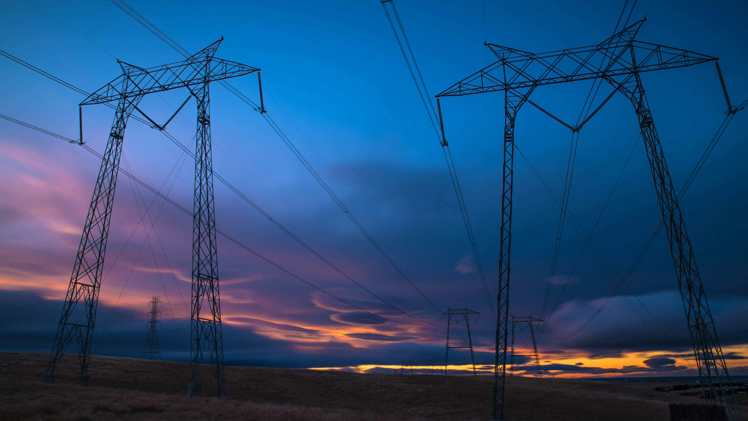 Electricity pylons at night