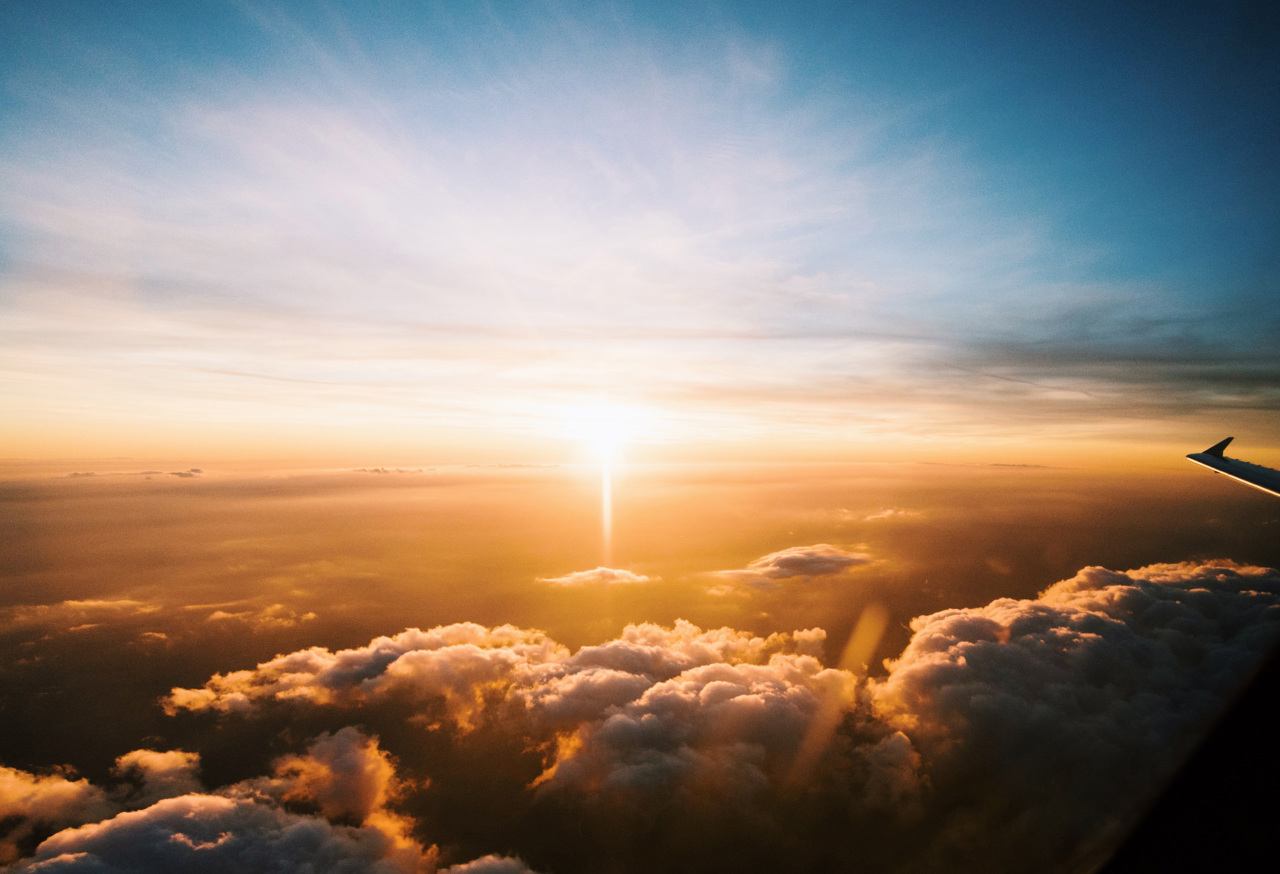 Plane wing above clouds