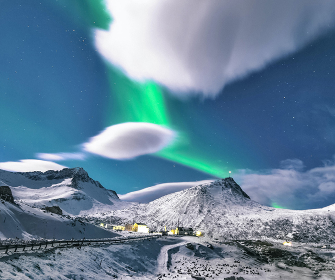Northern lights over a snowy town
