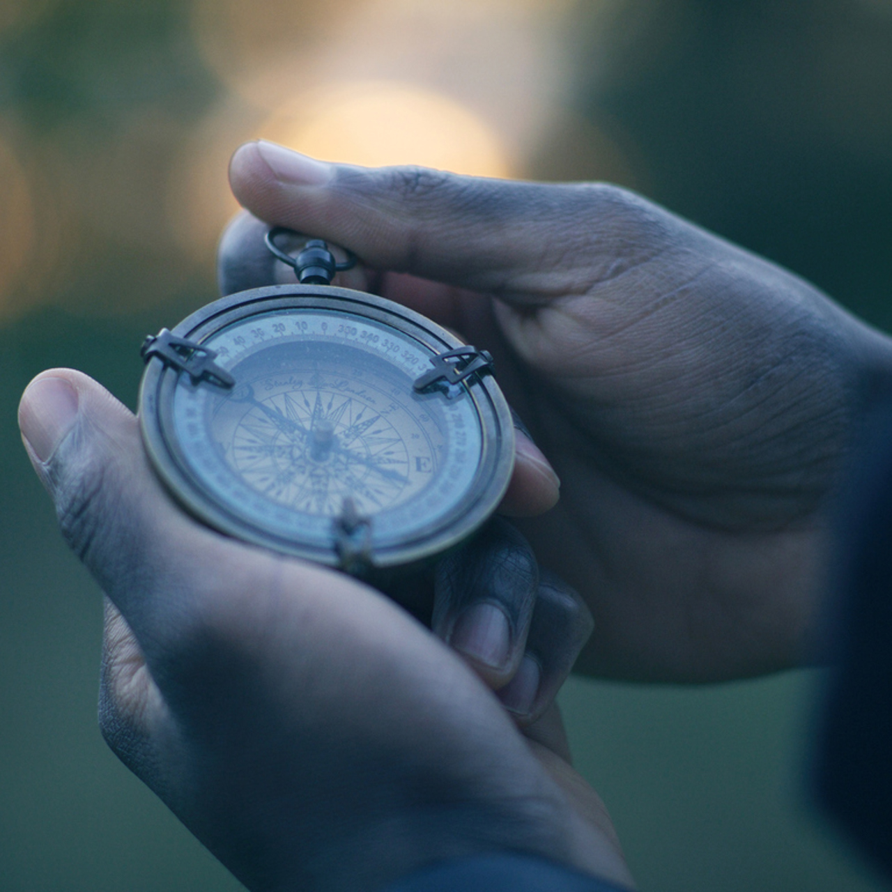 Man Holding Compass