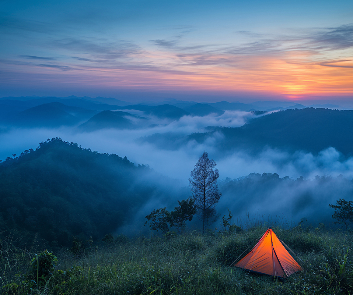 Tent with misty background of mountains