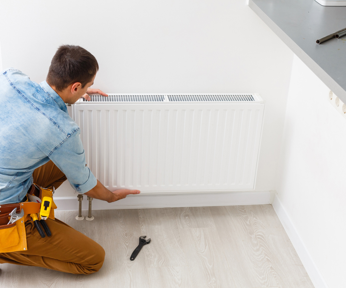 Man fixing radiator