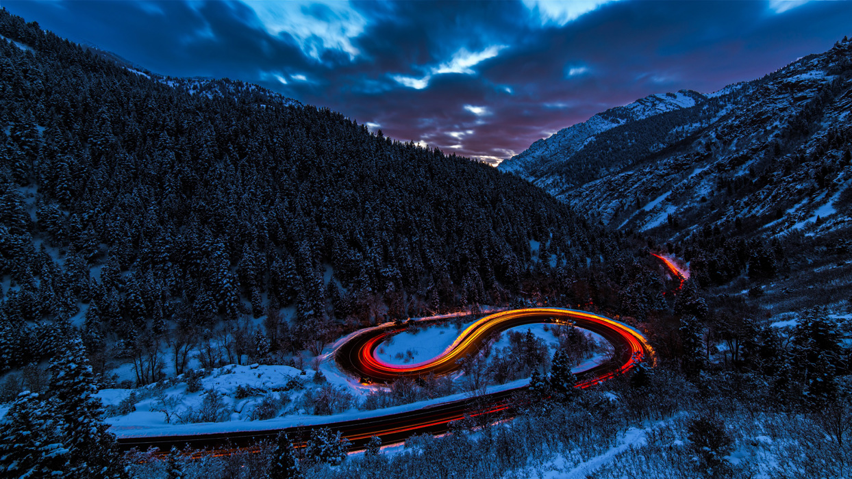 Winding road in snowy countryside