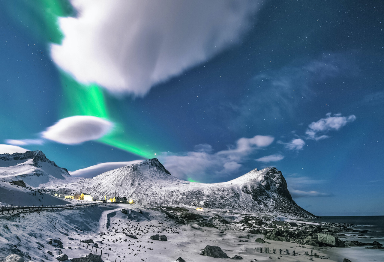 Northern Lights above snowy town